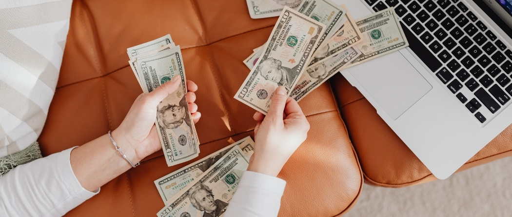 a hand counting money