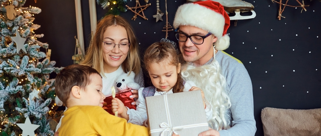 family opening gifts at Christmas