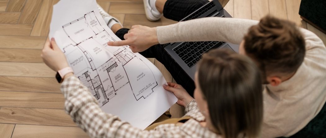 couple looking at blueprint