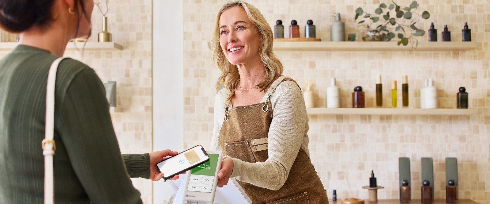 Customer tapping to pay on payment device
