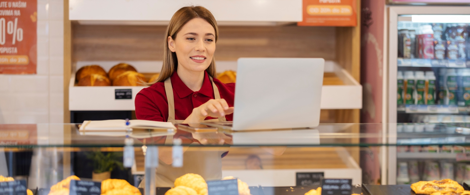 bakery owner looking at laptop