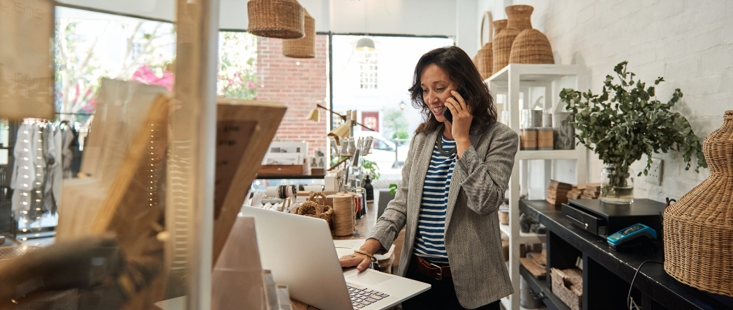 busy business lady on the phone and computer
