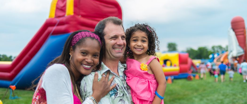 Family at a fall festival with inflatables