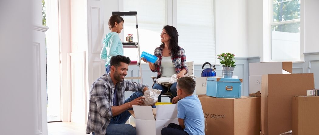 family unpacking boxes