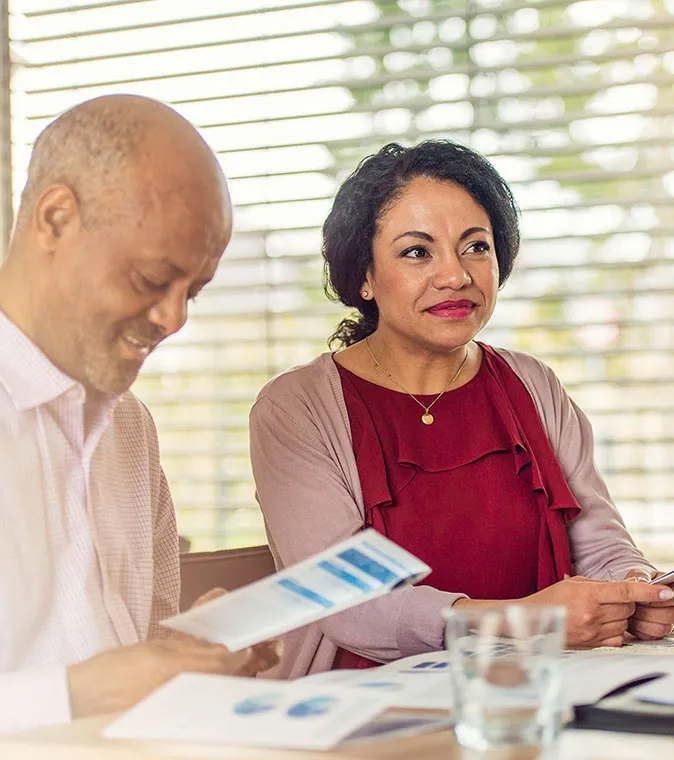 A man and woman meeting to discuss personal banking.