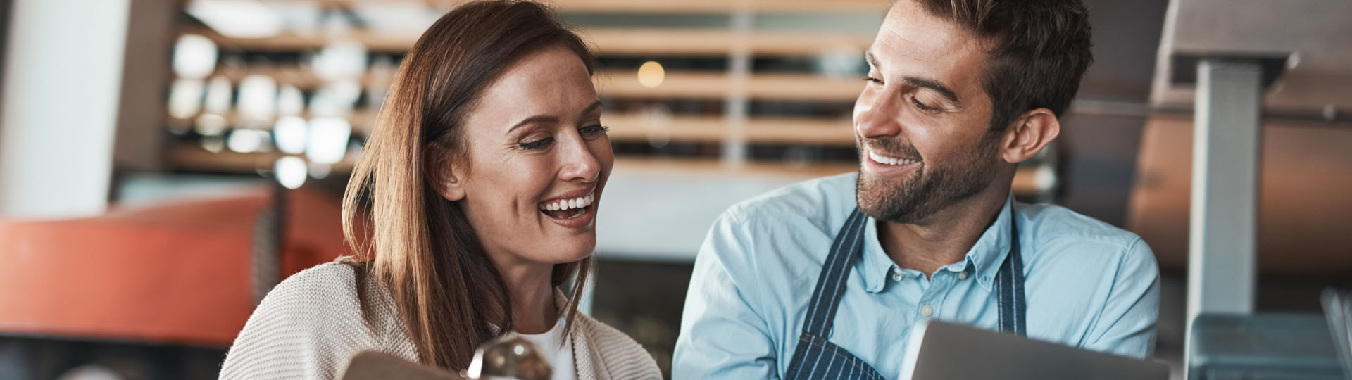 Coworkers smiling and laughing.
